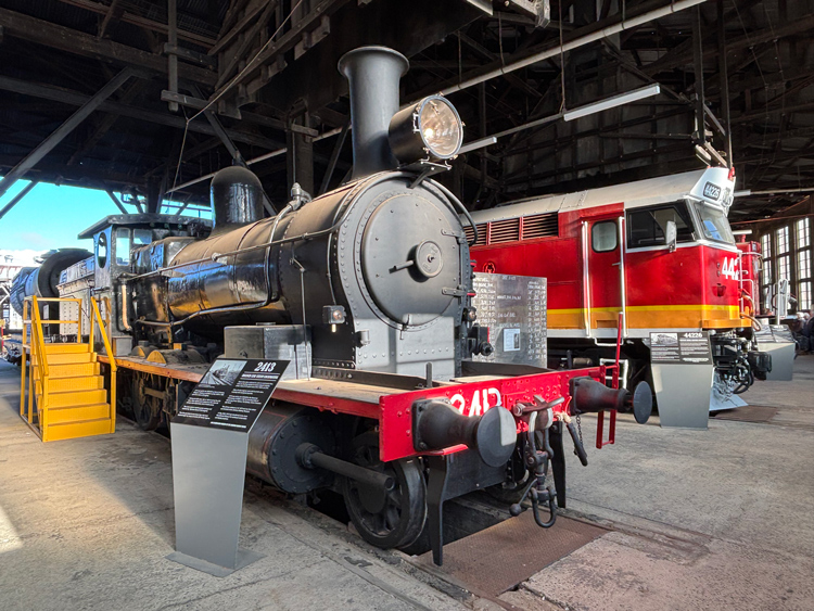 NSWGR steam locomotive 2413 displayed within the Junee Roundhouse Museum.
