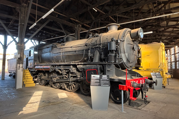 Steam locomotive 3609 displayed within the Junee Roundhouse Museum.