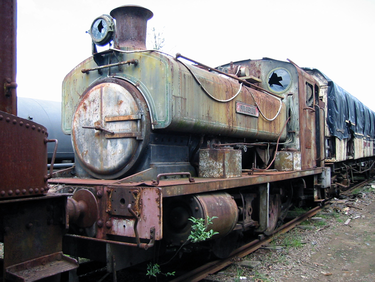 An old rusted train engine

Description automatically generated with medium confidence