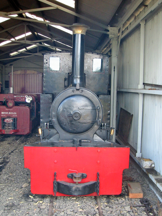 A picture containing indoor, red, train, old

Description automatically generated